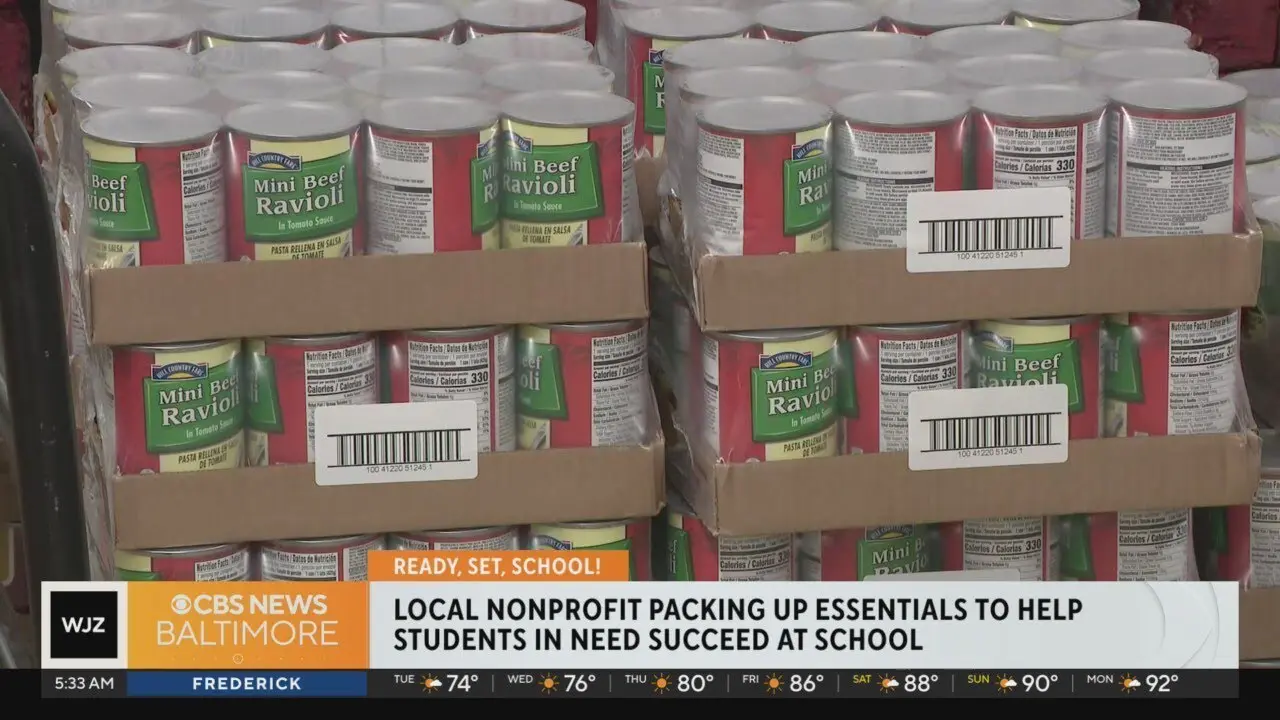 Cases of mini beef ravioli with a news chyron saying: Local nonprofit packing up essentials to help students in need succeed at school.