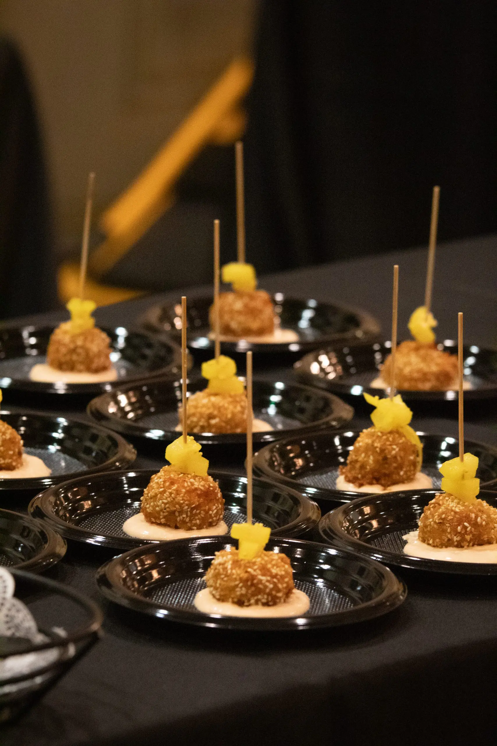 Small plates of food samples on a table.